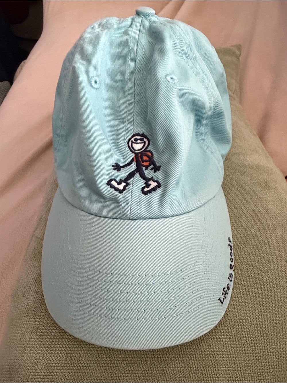 Life Is Good light blue dad hat with rollerblading stick-figure
